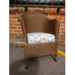 Lloyd Loom tub shaped armchair with drop-in sprung seat, stencilled made 1939