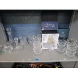 A selection of cut table glass to include a set of six grapefruit dishes and two wicker baskets,