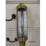 A reproduction brass cases ships barometer inscribed 'Roby Liverpool'