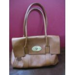 A ladies mid brown leather shoulder bag in the style of a British Fashion house Bayswater bag