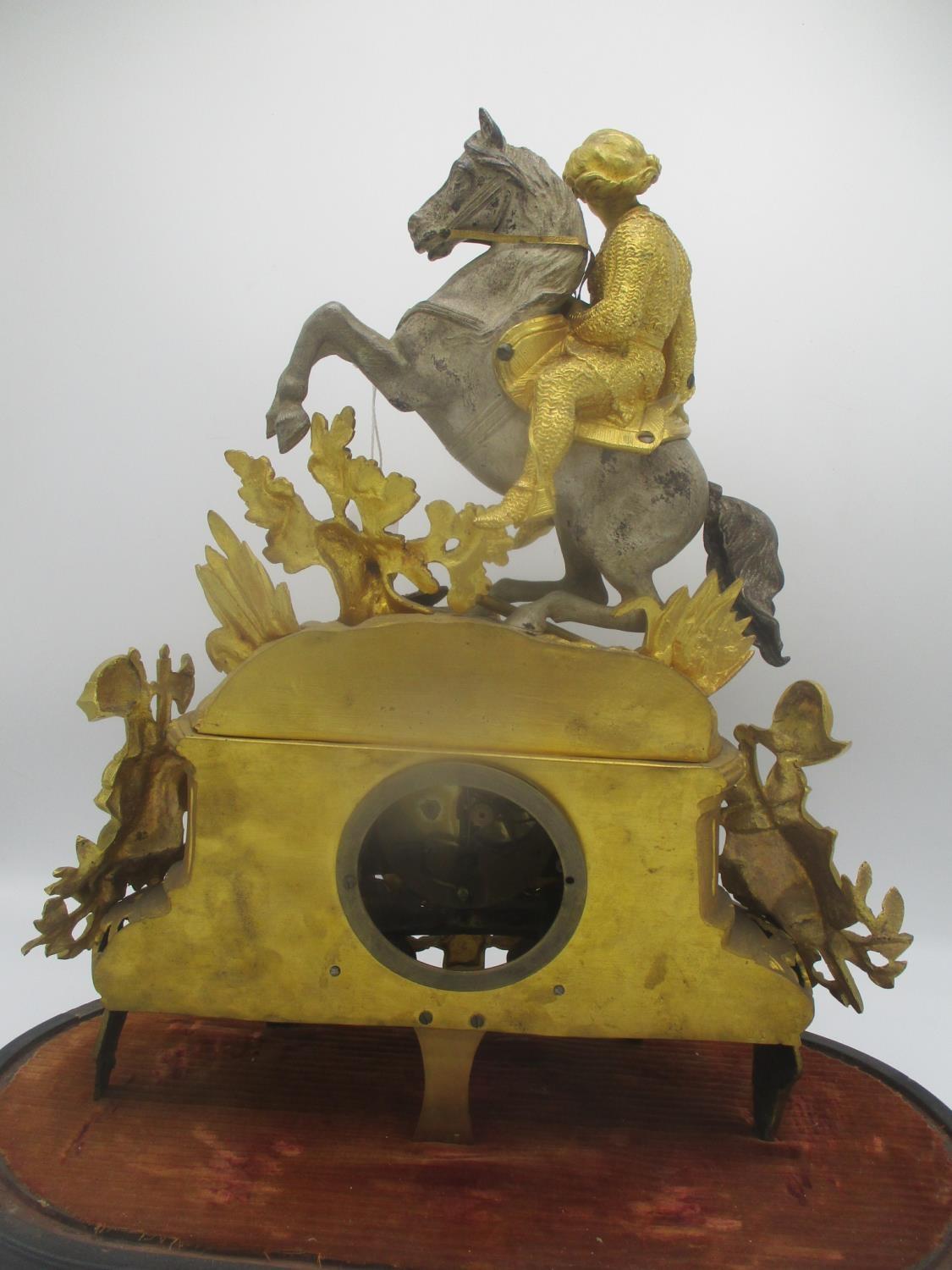 A late 19th century French gilt metal mantle clock decorated with a man on horseback, armour and - Image 5 of 7