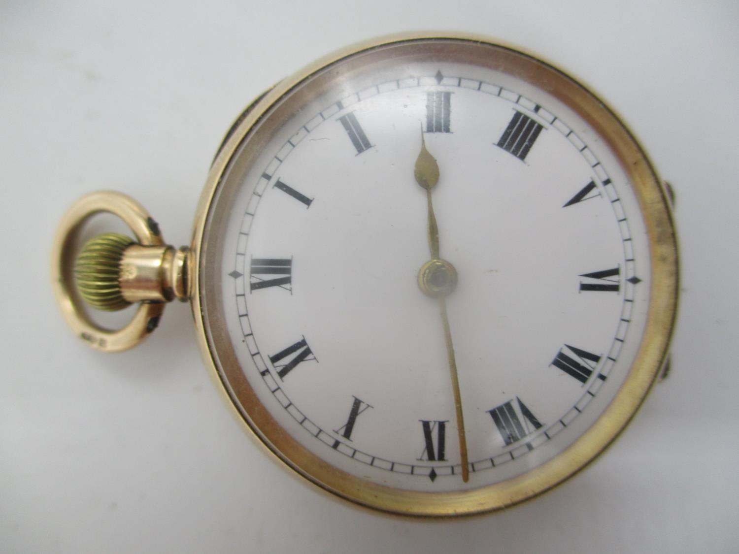 An early 20th century 12ct gold keyless wound fob watch, having a white enamel dial with Roman