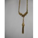 A Victorian 9ct gold necklace with a double link, a knot flanking by twin engraved floral panels and