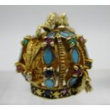 A gold pendant in the form of a Russian Imperial crown set with diamonds, emeralds, rubies and