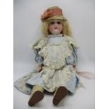An Armand Marseille German bisque headed doll, 390 with closing eyes, open mouth and jointed
