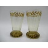 A pair of late 19th century Galle glasses with a tapered, ribbed body decorated with a fruiting