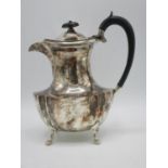 An early 20th century silver hot water jug by Fenton Brothers Ltd, Sheffield 1928, of waisted,