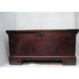 An 18th century continental walnut chest with iron corners, strapwork and handles, having a hinged