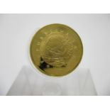 A Maltese £10 gold coin with a Maltese Falcon to the obverse 1975