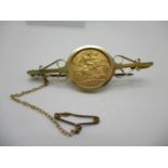 A 9ct gold brooch set with a George V half sovereign 1911