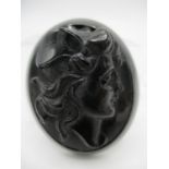 A Victorian Whitby jet brooch carved with the head of a woman with a feather in her hair, 2" x 1 1/