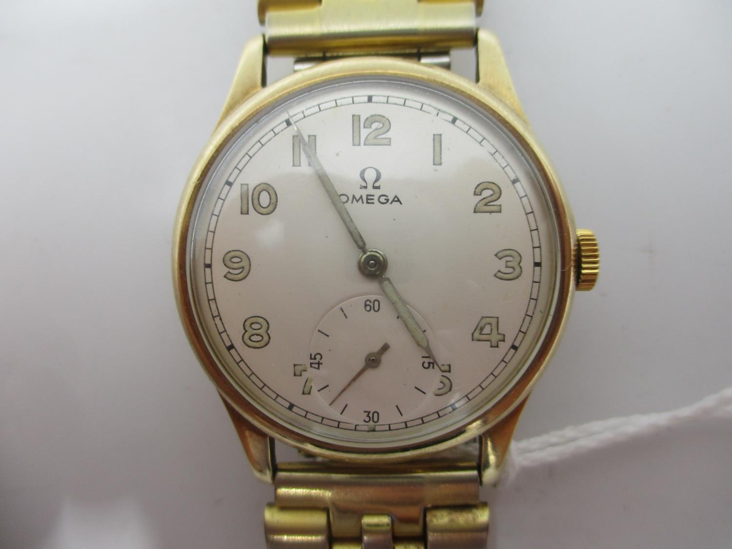 An Omega 9ct gold gents manual wind wristwatch circa 1944, the dial having Arabic numerals and