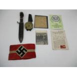 Military related items to include a German Nazi red and white armband, two participants cards