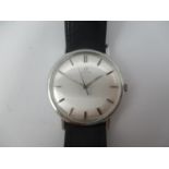 An Omega manual wind, gents stainless steel 1960s wristwatch having a silvered dial with centre