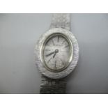 A Bueche - Girod manual wind 9ct white gold wristwatch, the silvered dial having baton markers and
