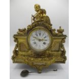 A mid/late 19th century French gilt metal mantle clock decorated with a cherub to the top with two