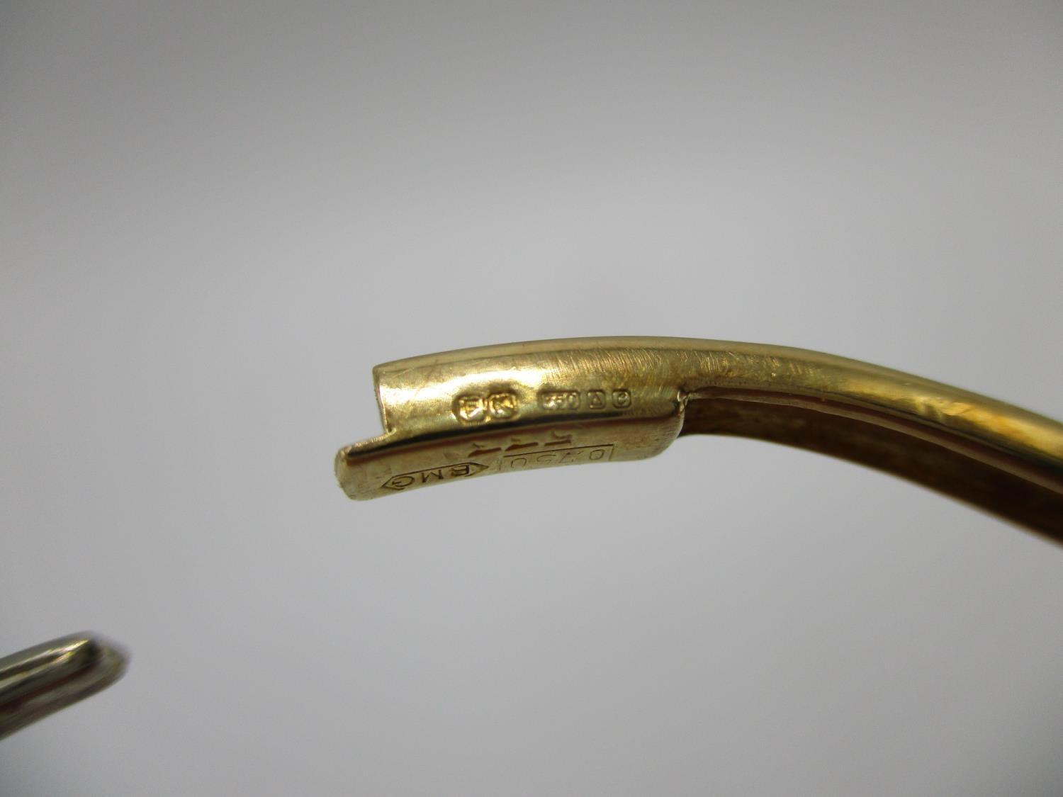 An 18ct gold coloured metal hinged bracelet of wave design set with fifty two diamonds, stamped - Image 7 of 7
