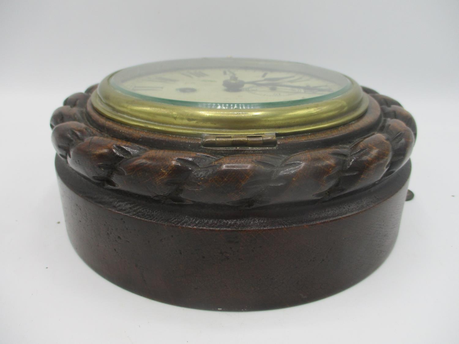 An early 20th century ships clock in an oak rope twist case, the dial having Roman numerals and a - Image 2 of 3