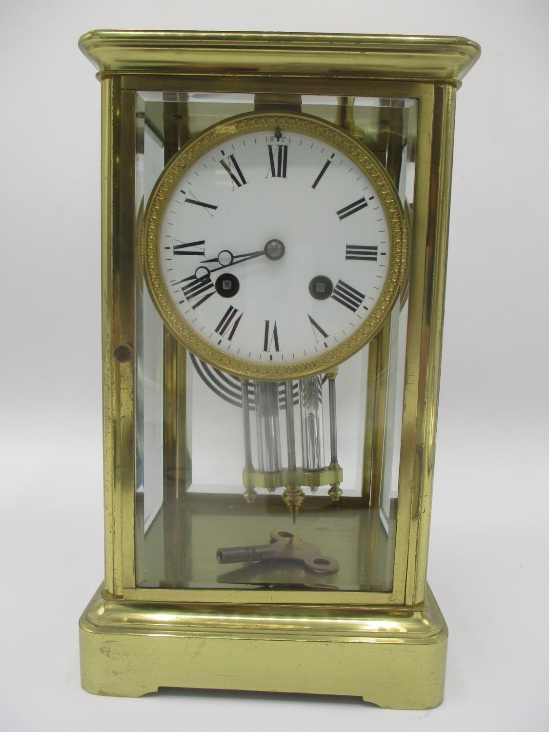 A late 19th century French 8 day brass mantle clock having a mercury pendulum, the movement signed A