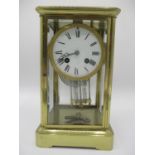 A late 19th century French 8 day brass mantle clock having a mercury pendulum, the movement signed A