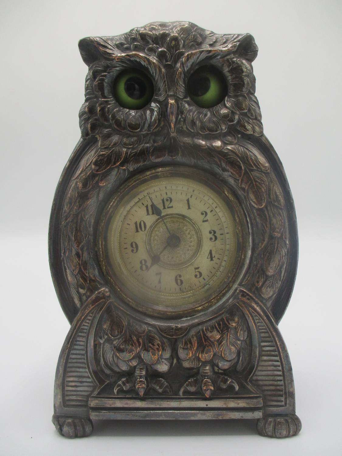 An early 20th century Arts & Crafts silver plated fronted mantle clock modelled as an owl with