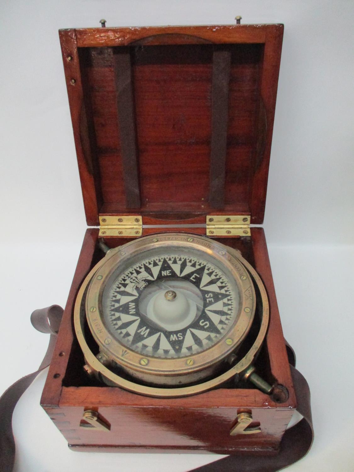 An E Dent & Co London brass cased government issue ships compass circa 1900 with black and off white