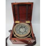 An E Dent & Co London brass cased government issue ships compass circa 1900 with black and off white