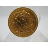 An Elizabeth II gold full sovereign with St. George to the obverse, 1966