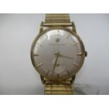 A Girard Perregaux 18ct gold gents manual wind wristwatch having a silvered dial with baton