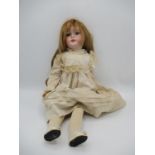 A Mignon Felix Arena German bisque headed doll with biplane logo, closing eyes, open mouth and