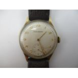 A Movado manual wind 9ct gold gents wristwatch, the silvered dial having Arabic numerals and