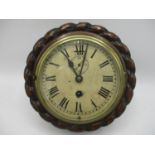 An early 20th century ships clock in an oak rope twist case, the dial having Roman numerals and a