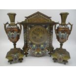 A late 19th century gilt metal cloisonne clock garniture set, the clock of architectural form having