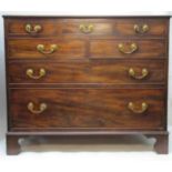 A George III mahogany chest of three short in line drawers, over two short and one long drawer, on