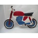 A 1950's children's Mobo motorcycle pedal toy 24" H to the handle bars