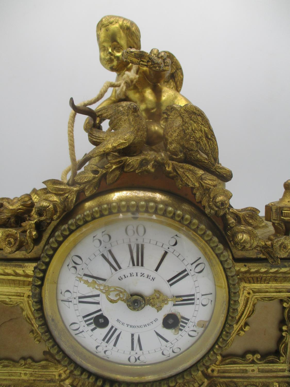 A mid/late 19th century French gilt metal mantle clock decorated with a cherub to the top with two - Image 2 of 7