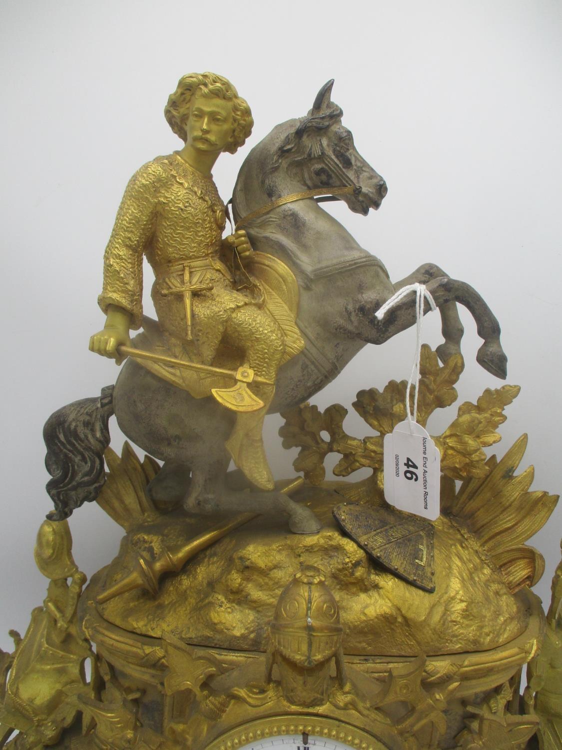 A late 19th century French gilt metal mantle clock decorated with a man on horseback, armour and - Image 2 of 7