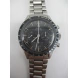 An Omega premoon, Speedmaster Ed White, manual wind, stainless steel gents wristwatch. The black