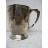 A 1930s silver pint tankard by Edward Barnard & Sons Ltd, London 1934 of tapered form on a stepped