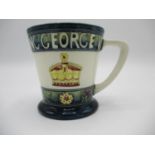 A Moorcroft mug to commemorate the Coronation of Queen Elizabeth and King George VI May 1937