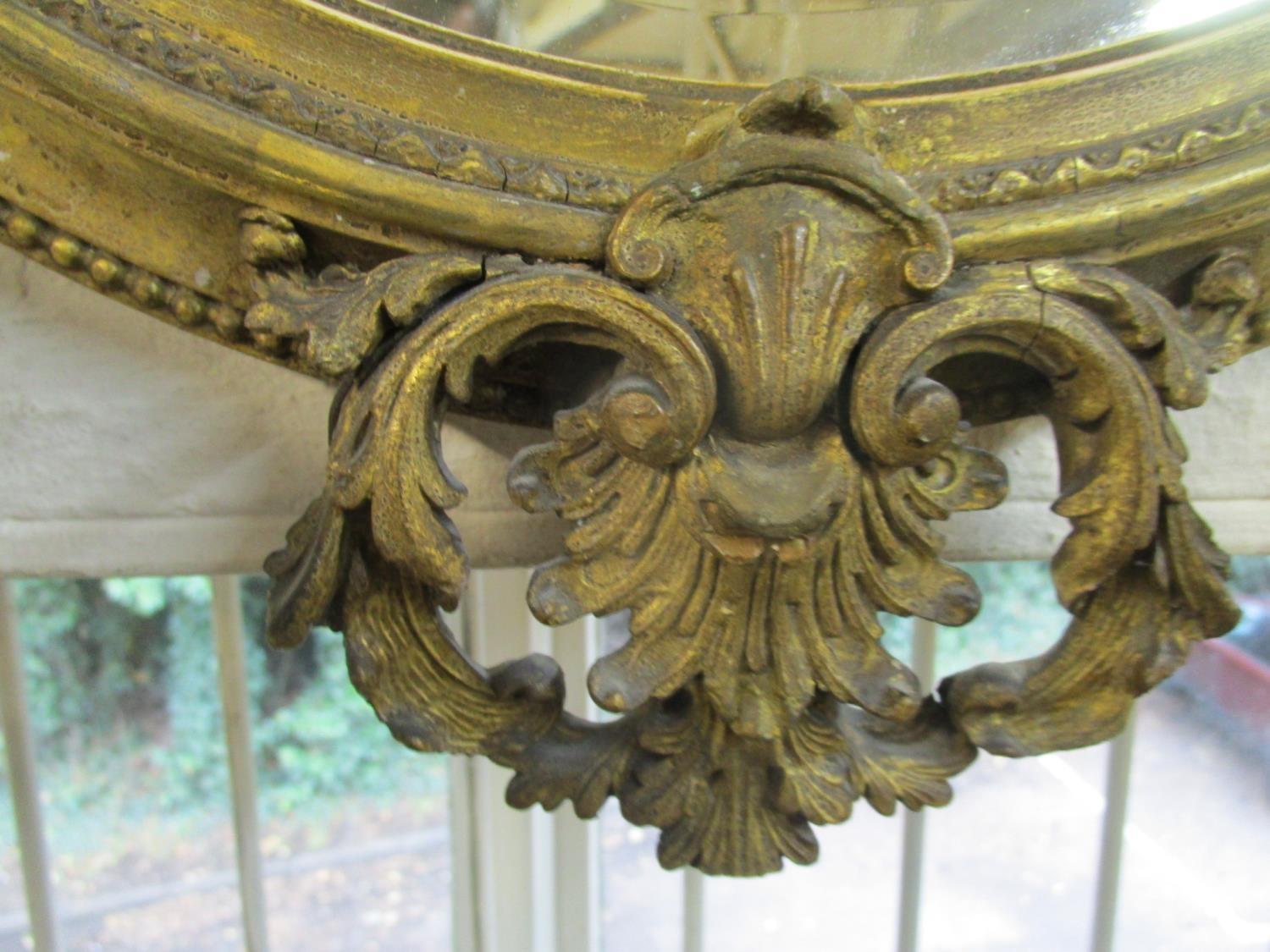 A late Victorian oval gilt framed wall mirror with scrolled leaf and styalized acanthus leaf - Image 6 of 6