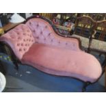 A Victorian mahogany carved button back upholstered chaise longue 36" H x 67" W