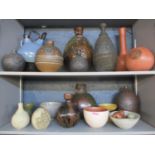 A collection of pots and vases depicting worldwide styles, all signed Maria