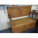 A 20th century light oak monks bench 40 x 39" as a bench seat and 30 x 39" as a table with chest