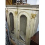 A large modern painted display cabinet, having gilt highlights and two arched top doors 70 3/4" H