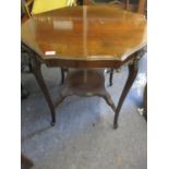 An early 20th century octagonal mahogany two tier occasional table
