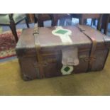 An early 20th century canvas and leather trunk