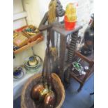 A mixed lot to include an African hardwood CD holder, three warming pans in a wicker basket, a metal