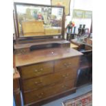 A pair of Edwardian mahogany dressing tables with swing mirrors above