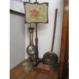 A Regency mahogany pole screen, a barometer, a pair of wine bottle coasters, a warming pan, a